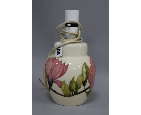 A MOORCROFT POTTERY LAMP BASE, Magnolia pattern on cream ground, impressed marks to base, height approximately 24cm (includin