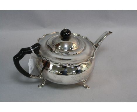 A PRESENTATION SILVER TEAPOT, on three hoof feet, with moulded top, ebonised high shaped loop handle and finial, inscribed 'B