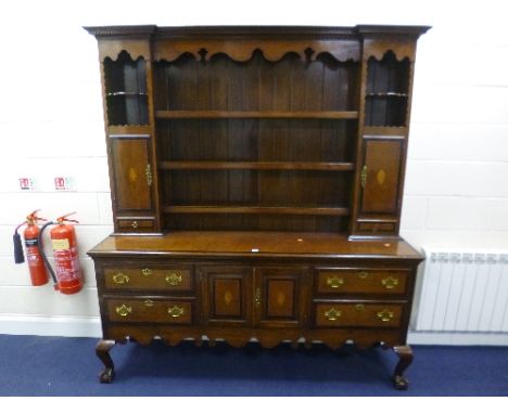 A 19TH CENTURY OAK, MAHOGANY CROSSBANDED AND CHEVRON INLAID DRESSER, the plate rack with two small cupboards and spice drawer