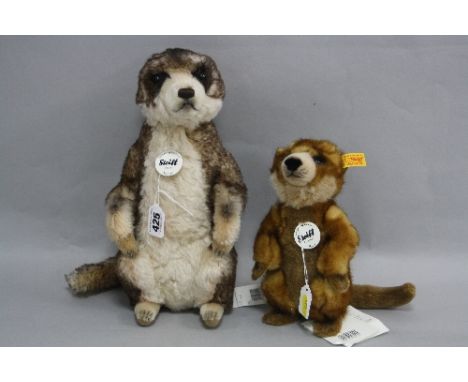 TWO STEIFF MEERCATS, 'Mungo' No.071249 and 'Rico' No.64425, both with button in ears and orange labels, height of tallest app