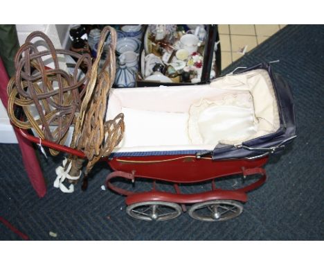 A DOLL'S PRAM, and six carpet beaters