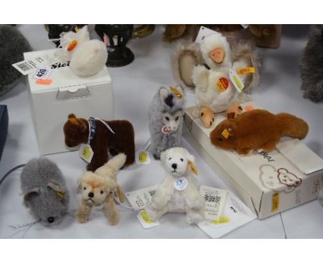 A GROUP OF EIGHT STEIFF MINIATURE ANIMALS/KEYRINGS, to include 'Piff' Mouse, Duck, Donkey, 'Golden Retriever' etc, all with b
