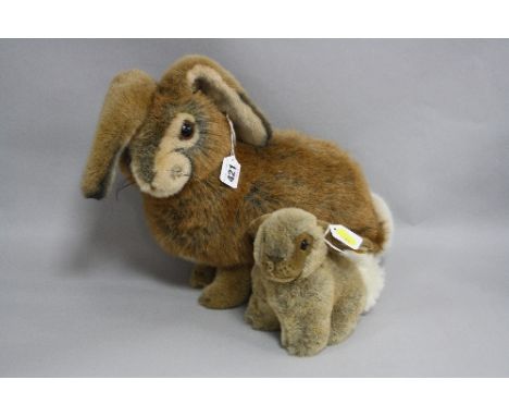 TWO STEIFF RABBITS, 'Mummel' No.077654, height approximately 29cm and smaller No.077234, both with button in ears and orange 