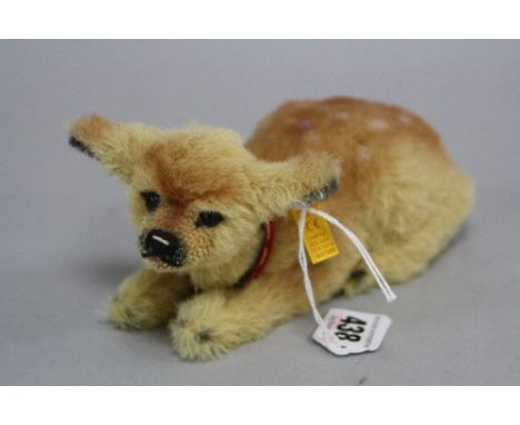 A BOXED STEIFF FAWN, button in ear and orange label, length approximately 18cm