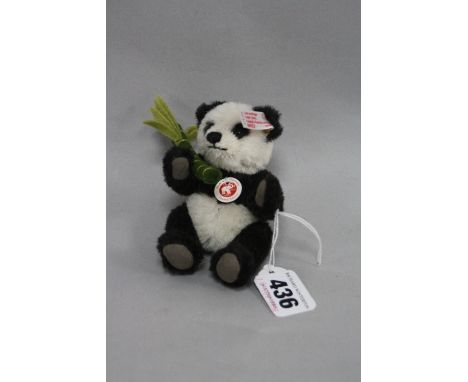 A BOXED LIMITED EDITION STEIFF MINIATURE PANDA, No.037313, 452/3000, with button in ear and white label, height approximately