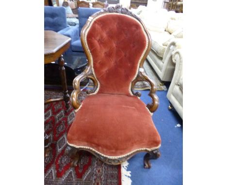 A VICTORIAN BUTTON BACK CHAIR, with carved walnut frame