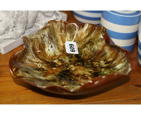 A LINTHORPE POTTERY DISH, designed by Christopher Dresser, shape No.276, brown, cream and green glazes, impressed factory, 'H