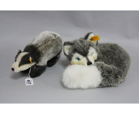 A STEIFF 'DACHS' BADGER, No.033537 and a Steiff Husky, curled, No.079672, both with button in ear and orange labels (2)