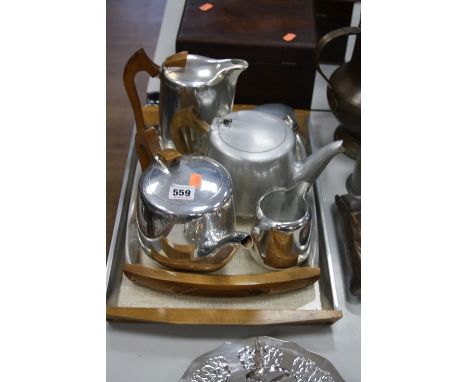 PICQUET WARE, a four piece tea service, another teapot and two trays (7)