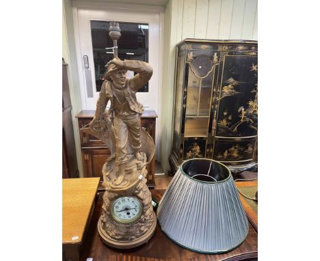 Composite fisherman figure clock table lamp, 76cm high.