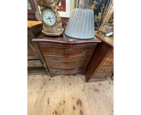 Mahogany serpentine front chest having brush slide above four long drawers on bracket feet, 76cm by 70cm by 48cm.