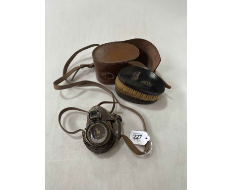 WWII compass with WWI case, and pair of hair brushes.