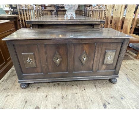 Antique oak quadruple panel front coffer on bun feet, 69cm by 139cm by 49cm.
