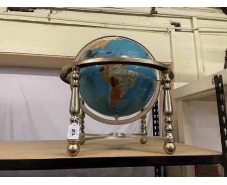 Terrestrial globe on brass stand, approximately 55cm high.
