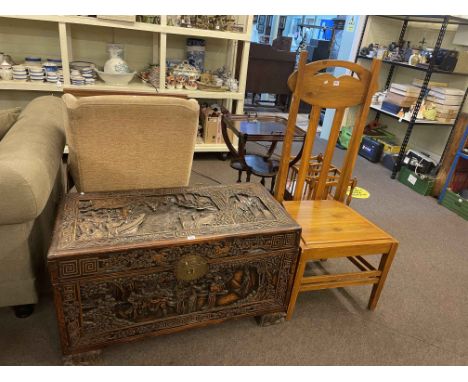 Oriental carved camphorwood trunk, 58.5cm by 105cm by 52cm, and high back side chair.