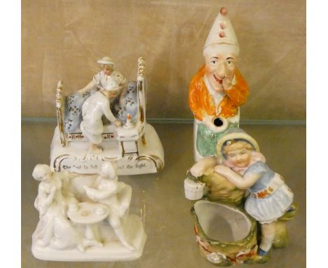 An early 20th century spill vase in the form of a seated Punch, together with two farings and a ceramic figure of girl (4)