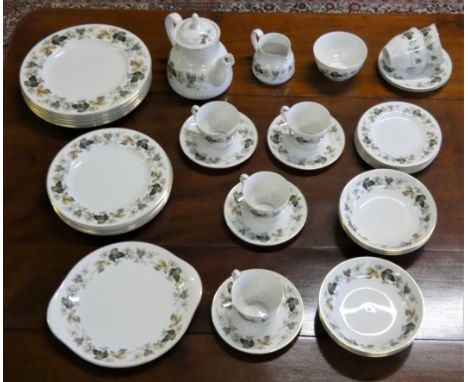 A Royal Doulton Larchmont pattern dinner service, together with a wall barometer (2)