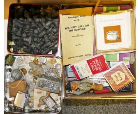 A box of vintage pop bottle stops made of early plastic, together with a box of various coinage, a cased cigarette lighter, a