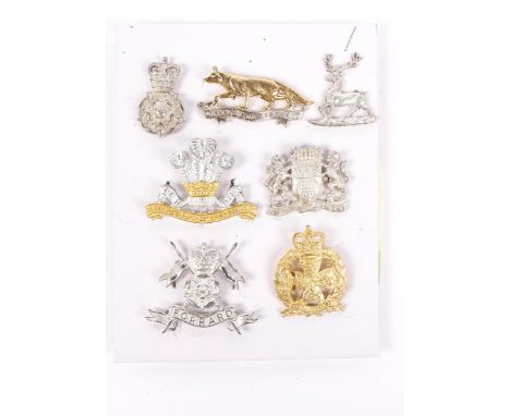 7 officers cap badges in silver and gilt, from stock held by Pitt (Herts &amp; Beds Yeomanry and Queen's Own Yorkshire Dragoo