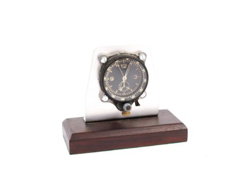 A WWII German aircraft clock of the type fitted to Me109. Basically GC (movement AF, front knurled ring loose), mounted for d