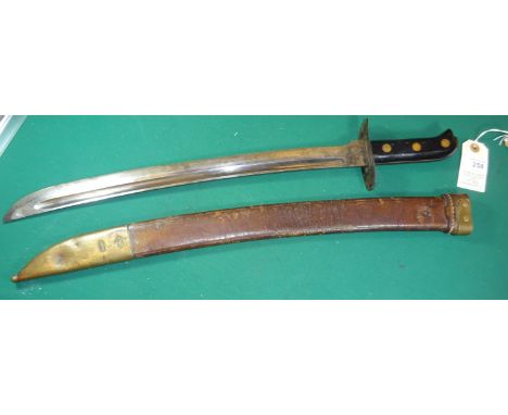A Dutch kleewang sidearm, with curved single edge blade 17", in its leather scabbard stamped "2 40", brass mounts. GC £70-80