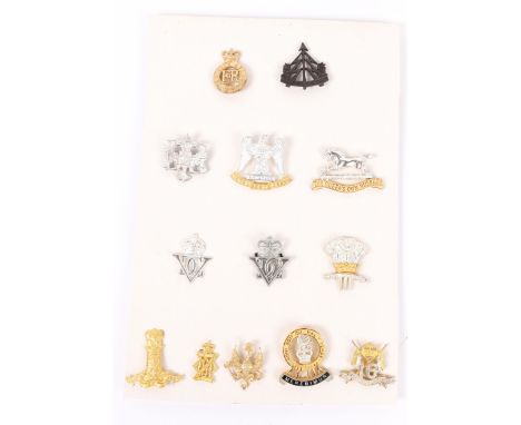 12 Cavalry officer's cap badges in silver and gilt, from stock held by Gaunt for Provisioning Officers appointed Tailors when