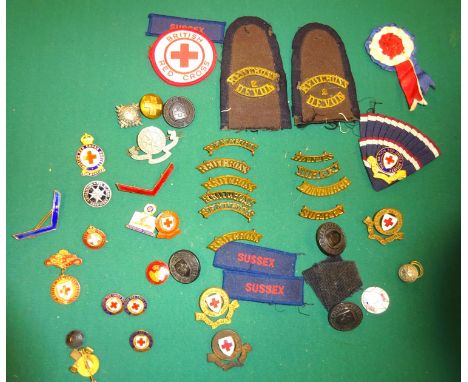 A small collection of British Red Cross/Nursing items: BRC Medal for Proficiency in Red Cross Nursing (named 12523 A C Sigger