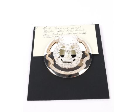 An MOD Contract sample of a Gordon Highlanders plaid brooch, with copy of London Badge &amp; Button Co. MOD Approval Contract