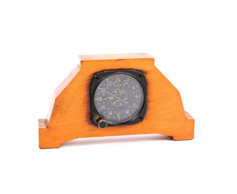 An American WWII Airforce/Naval 8 day clock with 24 hour and "Civil Date" dial, by Waltham Watch Co, mounted as a mantel cloc