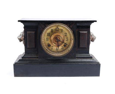 A 19th century American mantel clock, of iron originally finished to imitate stone, now badly painted black, the movement mar