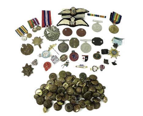 A collection of WWI and WWII badges and dog tags including British War medal and Victory medal both inscribed to rims '2 Lieu