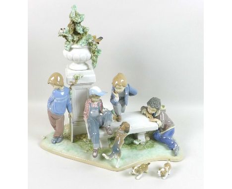 A large Lladro figural group, 'Puppy Dog Tails', 5539, sculpted by Antonio Ramos, on integral base, 41 by 25 by 38cm high. 