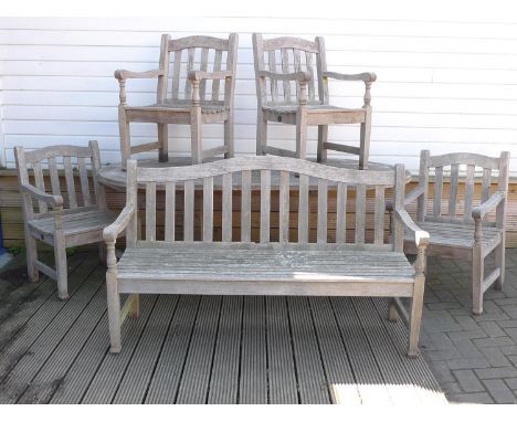A wooden garden dining set, by Barlow Tyrie, Waveney, comprising an oval table, 109 by 200 by 70cm high, four open arm chairs
