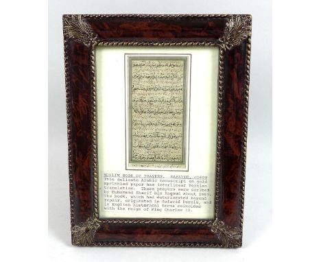 A handwritten Arabic manuscript page from a Book of Prayers by Muhammad Sharif bin Maqsud, with Persian translate in red inte