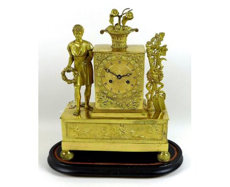 A French gilt brass figural mantel clock, 19th century, with glass dome and ebonised oval base, the engraved 3¼" dial with bl