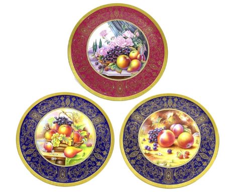 A pair of modern Royal Worcester chargers, hand painted fruit studies, with applied ?jewelled? enamels and dark blue border, 