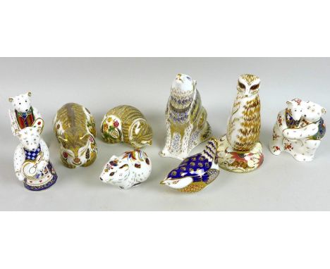 A group of Royal Crown Derby paperweights, including Meerkat MMVII, boxed, Wolf MMV, boxed, Cottage Garden Cat MMII, Cottage 