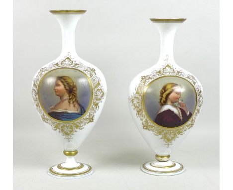 A pair of late 19th century French white opaline glass baluster vases, each decorated with a portrait roundel of a lady in pr