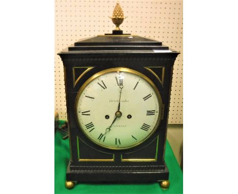 A 19th Century mantel clock by Brockbanks of London, the twin fusee movement with plain brass back plate and white enamelled 