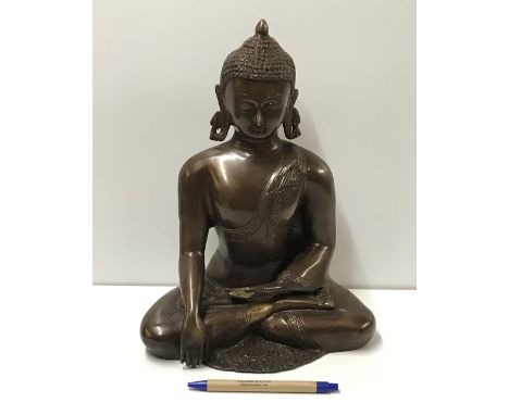 A modern cast bronze statue of Sakyamuni Buddha, 32 cm high CONDITION REPORTS Modern piece, no obvious damage. Approx 5kg. Se