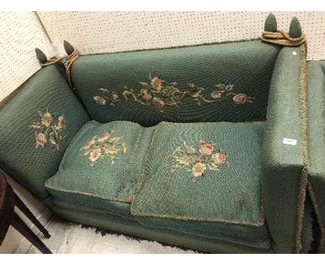 An early 20th Century green upholstered and floral spray needlework decorated Knowle sofa of typical form 161 cm wide x 82 cm