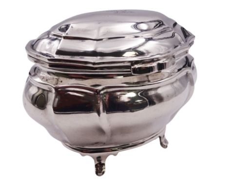 Edwardian silver tea caddy of bombe form, the hinged cover engraved with lion crest, upon four paw feet, hallmarked Goldsmith