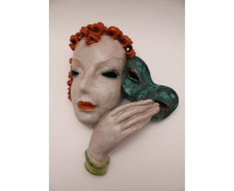 AN ART DECO GOLDSCHEIDER GLAZED TERRACOTTA WALL MASK, impressed 'No. 7081' and 'Made in Austria', 28cm highCondition Report: 