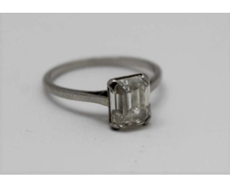 A SOLITAIRE DIAMOND RING, facet shouldered cushion cut stone set in white gold or platinum band (unmarked), gross weight; 3.1