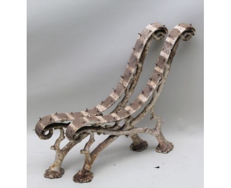 A PAIR OF CAST IRON BENCH ENDS of tree branch / root design, back height 71cm 