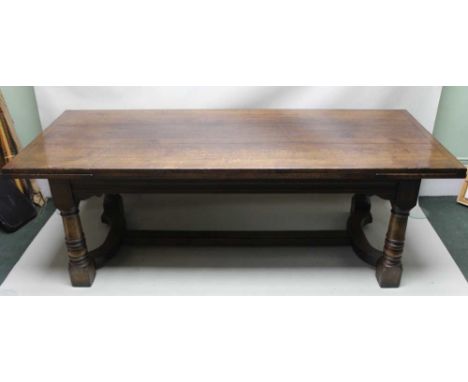 A GOOD QUALITY REPRODUCTION DINING SUITE comprising; rectangular draw leaf refectory style table, supported on four substanti