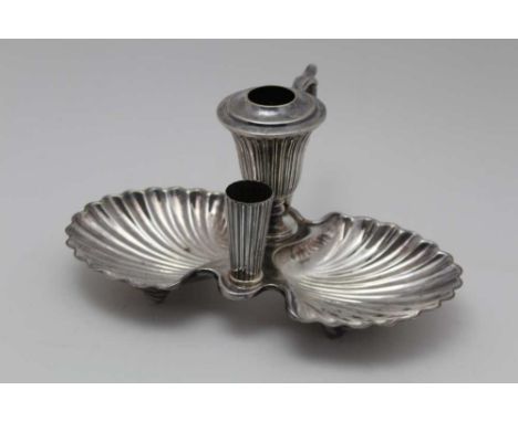 A SILVER PLATED CHAMBER STICK, having twin scallop side dishes, and scrolling handle, 10cm high 