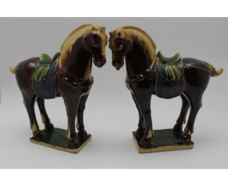 A PAIR OF TANG TYPE GLAZED CERAMIC HORSES, 26cm high 