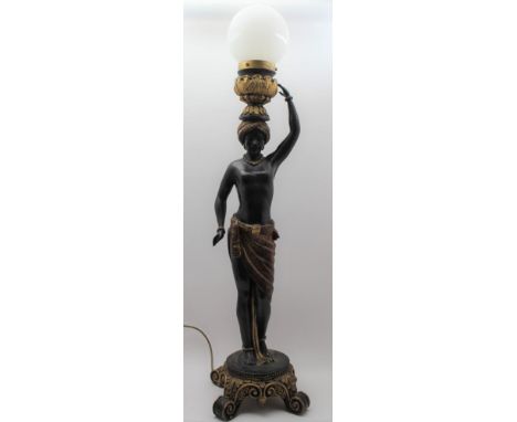 A 20TH CENTURY BLACKAMOOR LAMP, painted and gilded decoration, raised on scroll base, fitted white opaque globe shade, 93cm h