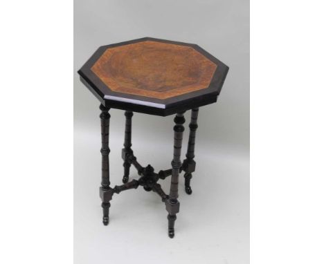 A 19TH CENTURY PART EBONISED &amp; MIXED WOOD OCTAGONAL TOPPED CENTRE TABLE, supported on ring turned &amp; blocked legs, uni